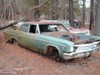 65 Impala sitting in the junk yard