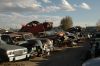 picture of parts in a classic car junk yard