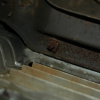 rusty nut behind tie bar