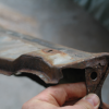 straightened rusty end of 64 Impala filler panel