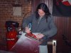A punk rock musician using an air sander